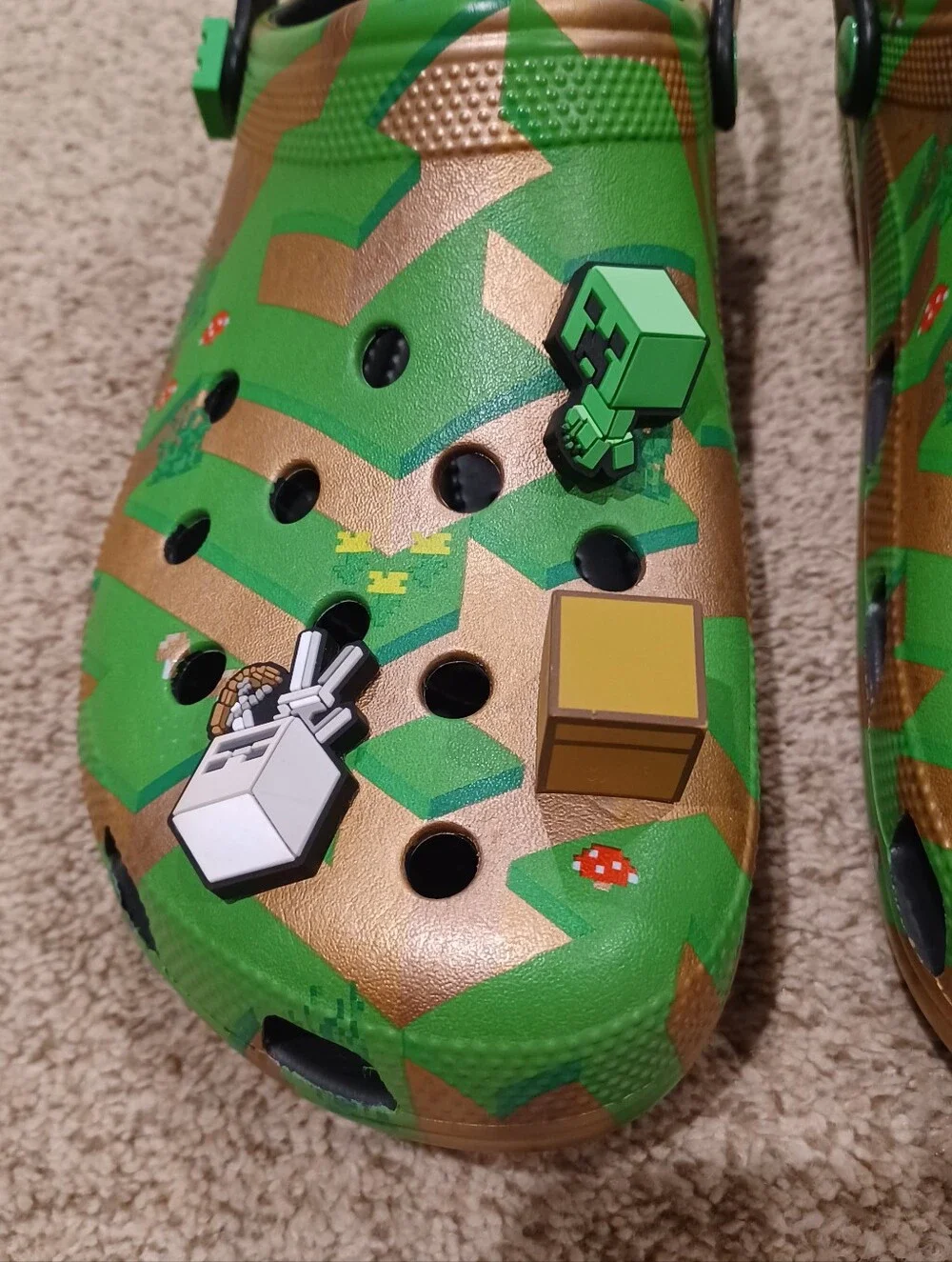 Crocs Minecraft Classic Clogs featuring a green and gold terrain & Jibbitz